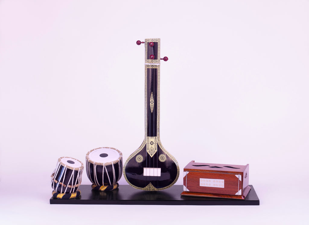 Model of a sitar and tabla on a white background